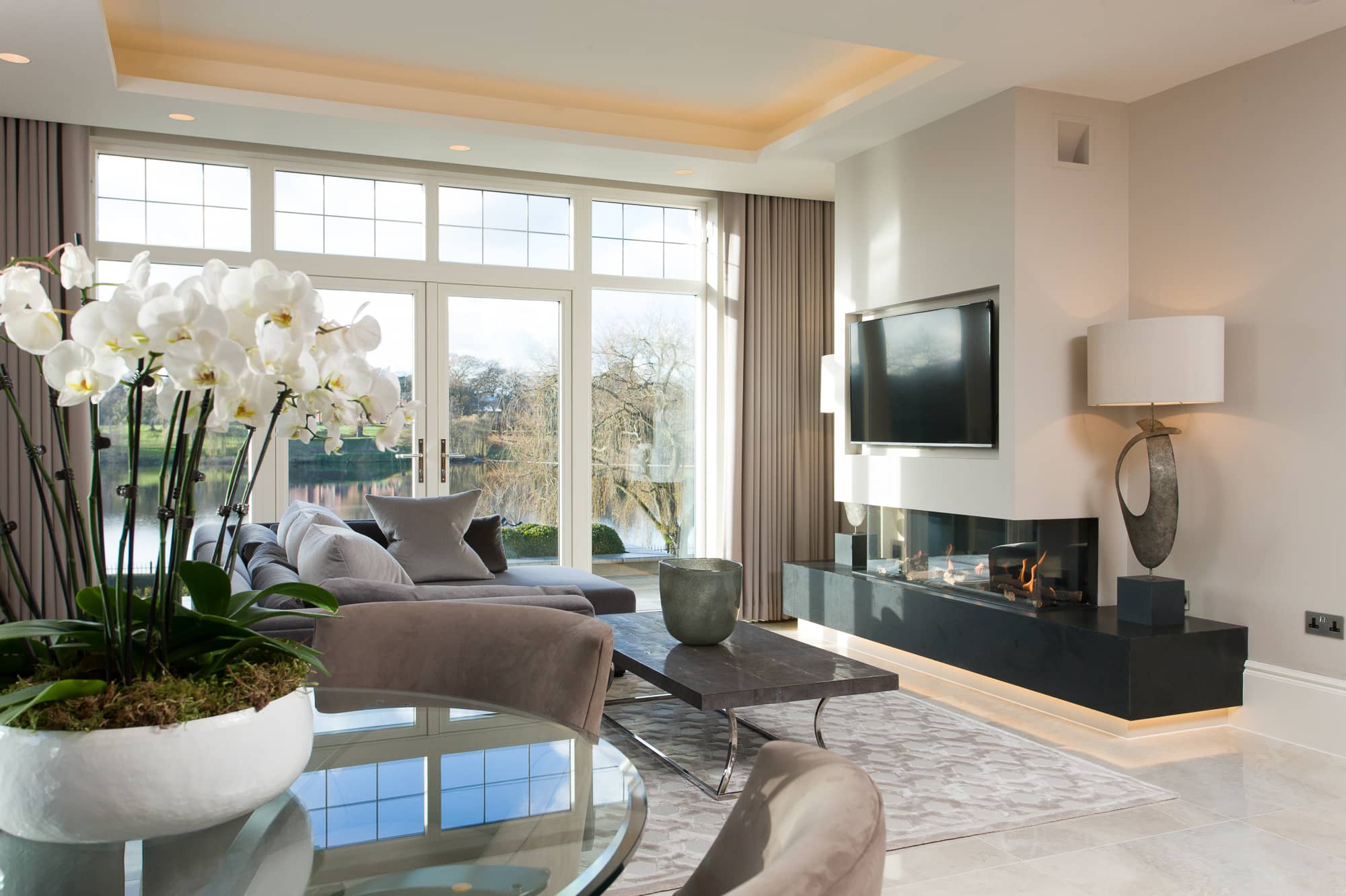 a living room filled with furniture and a fire place.